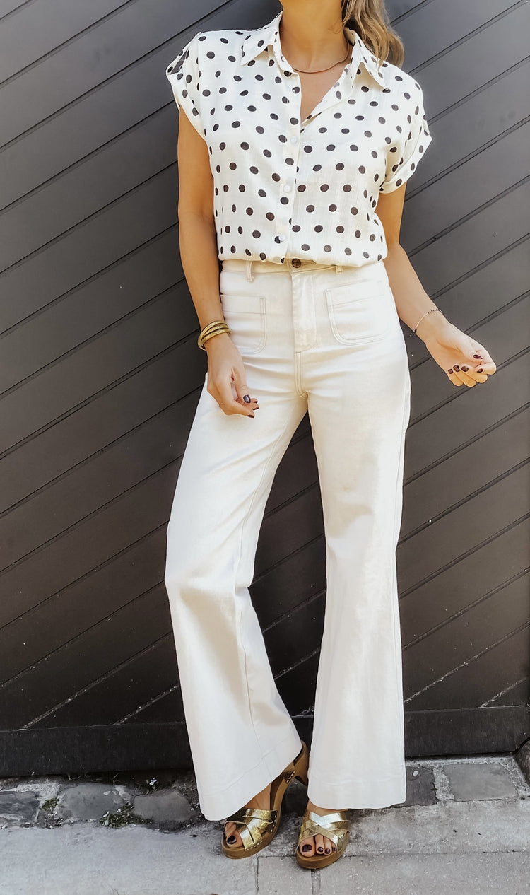 chemise beige à pois noirs
