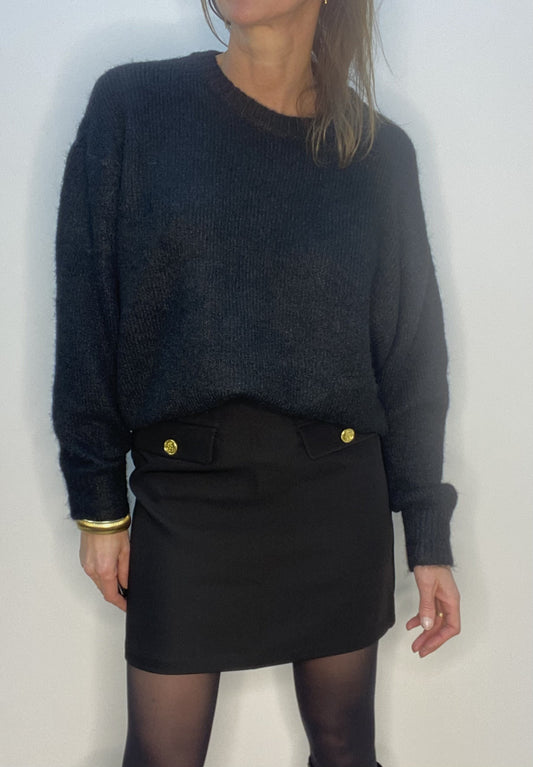 Jupe courte noire avec boutons dorés